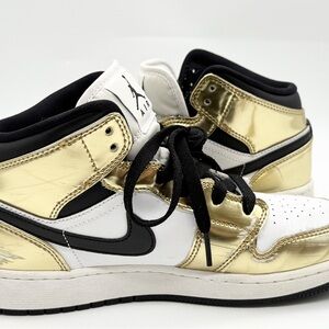 Boys Air Jordan’s size 5y Black and Metallic Gold